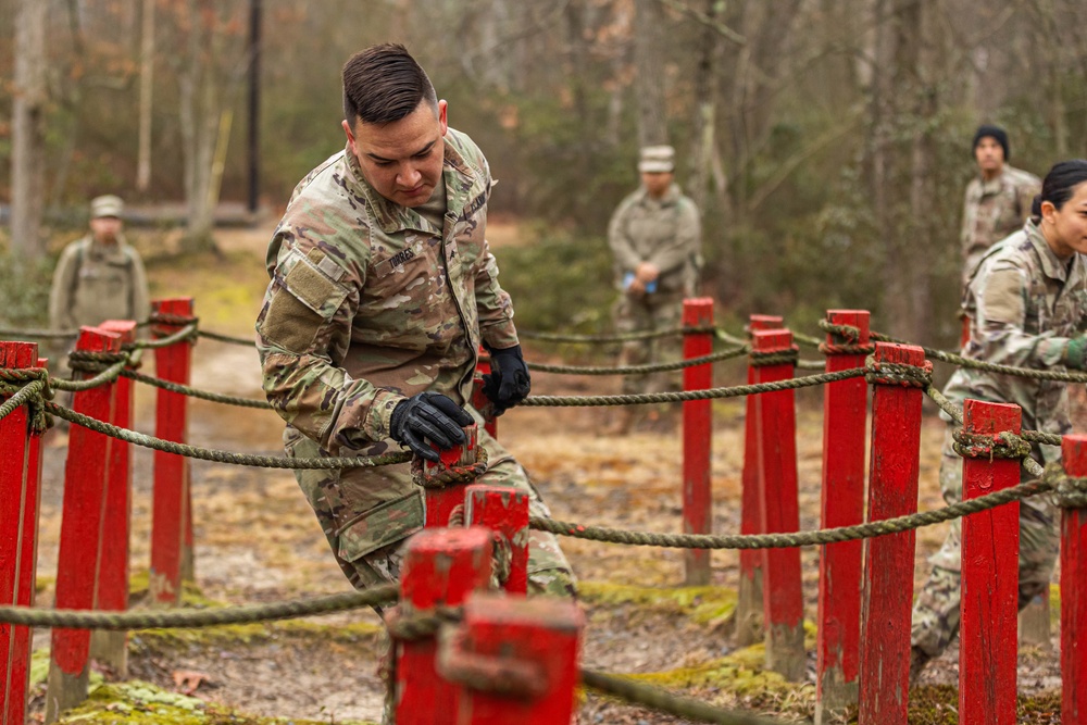 Sgt. Denzel Torres runs through an obstacle