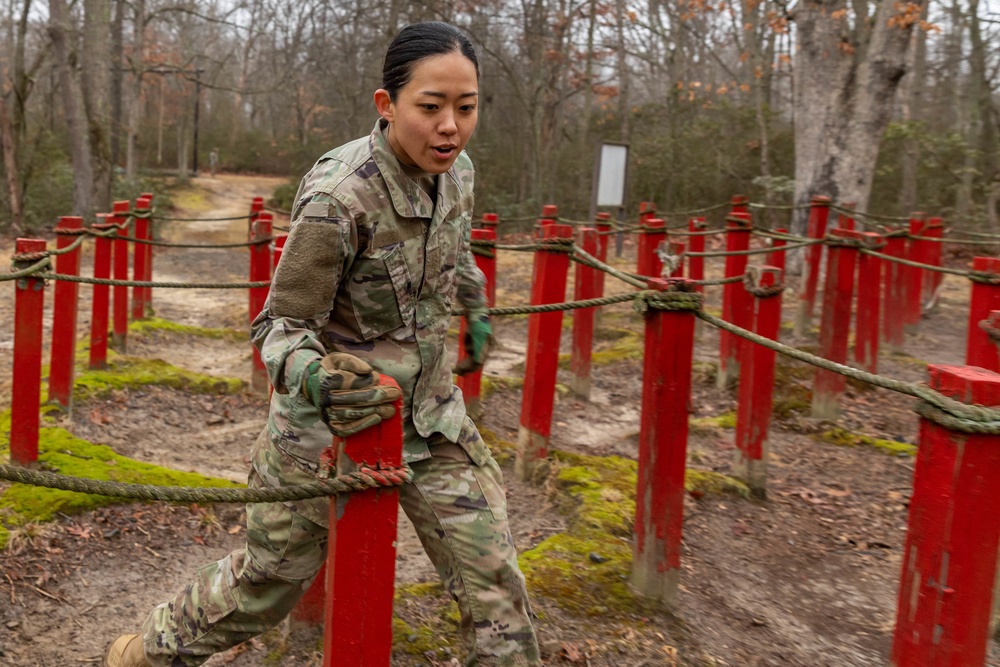 Sgt. Christine Won runs through an obstacle