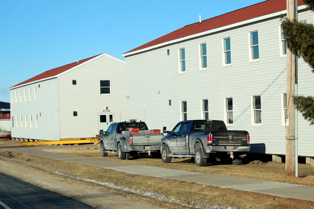 Contractors prepare World War II-era barracks buildings to be moved at Fort McCoy