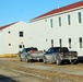 Contractors prepare World War II-era barracks buildings to be moved at Fort McCoy