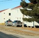 Contractors prepare World War II-era barracks buildings to be moved at Fort McCoy