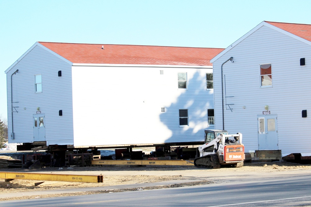 Contractors prepare World War II-era barracks buildings to be moved at Fort McCoy