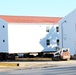 Contractors prepare World War II-era barracks buildings to be moved at Fort McCoy