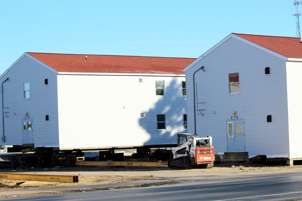 Contractors prepare World War II-era barracks buildings to be moved at Fort McCoy