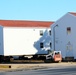 Contractors prepare World War II-era barracks buildings to be moved at Fort McCoy