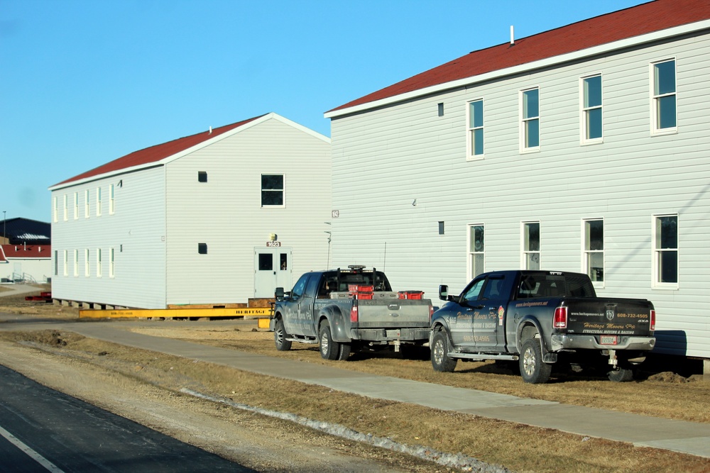 Contractors prepare World War II-era barracks buildings to be moved at Fort McCoy