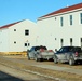 Contractors prepare World War II-era barracks buildings to be moved at Fort McCoy