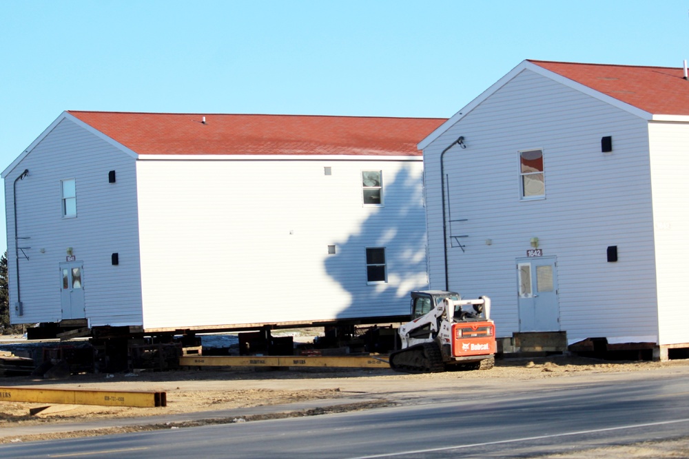 Contractors prepare World War II-era barracks buildings to be moved at Fort McCoy