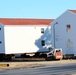 Contractors prepare World War II-era barracks buildings to be moved at Fort McCoy