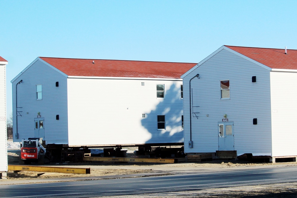 Contractors prepare World War II-era barracks buildings to be moved at Fort McCoy