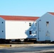 Contractors prepare World War II-era barracks buildings to be moved at Fort McCoy