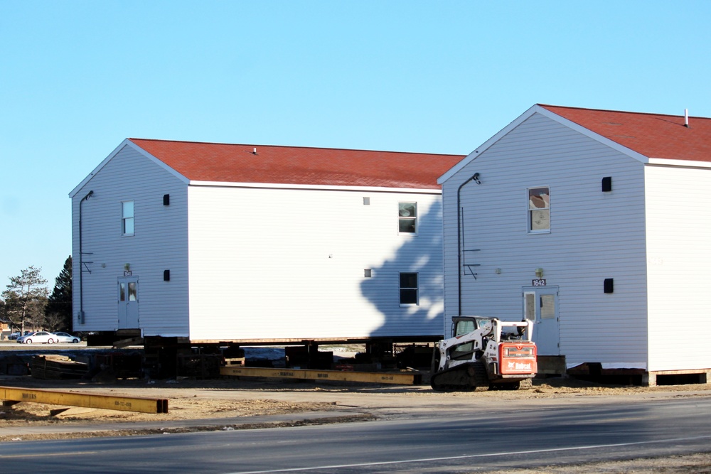 Contractors prepare World War II-era barracks buildings to be moved at Fort McCoy