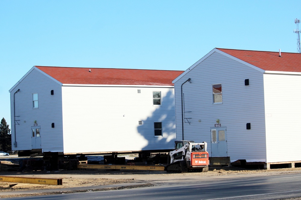 Contractors prepare World War II-era barracks buildings to be moved at Fort McCoy