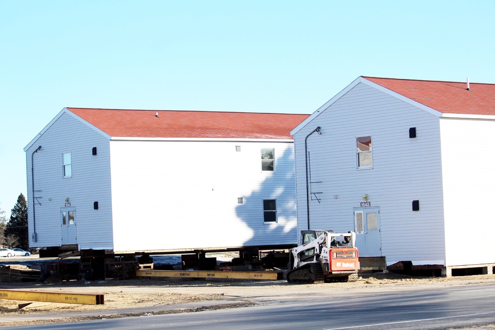 Contractors prepare World War II-era barracks buildings to be moved at Fort McCoy