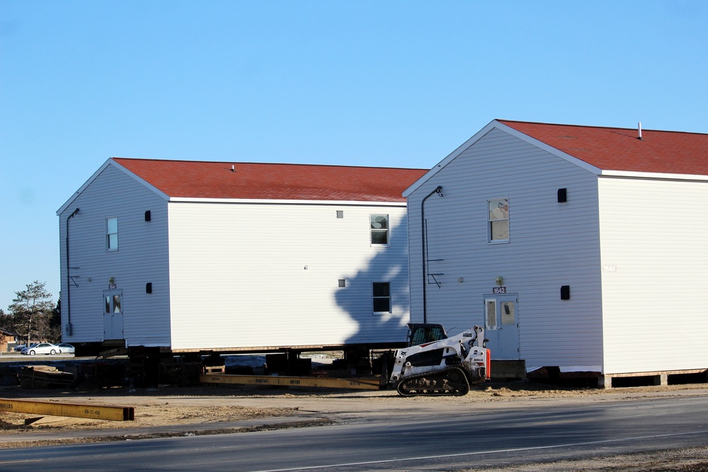 Contractors prepare World War II-era barracks buildings to be moved at Fort McCoy