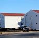 Contractors prepare World War II-era barracks buildings to be moved at Fort McCoy