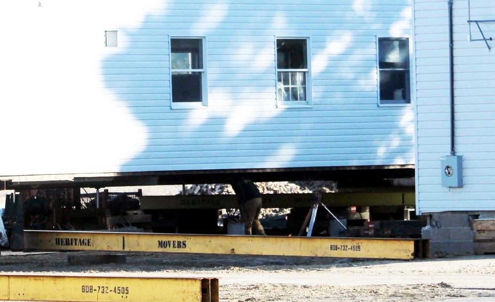 Contractors prepare World War II-era barracks buildings to be moved at Fort McCoy