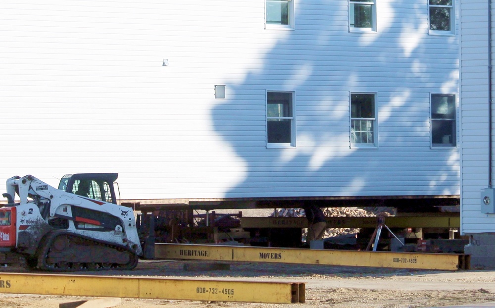 Contractors prepare World War II-era barracks buildings to be moved at Fort McCoy