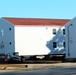 Contractors prepare World War II-era barracks buildings to be moved at Fort McCoy