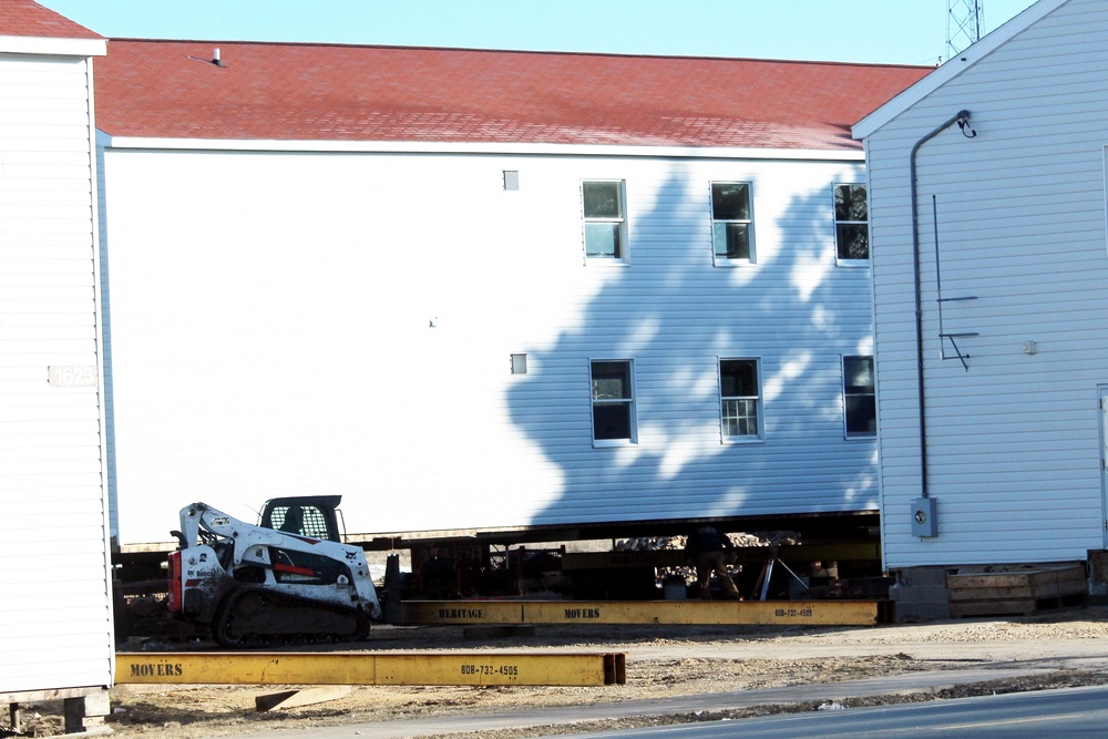 Contractors prepare World War II-era barracks buildings to be moved at Fort McCoy