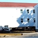 Contractors prepare World War II-era barracks buildings to be moved at Fort McCoy