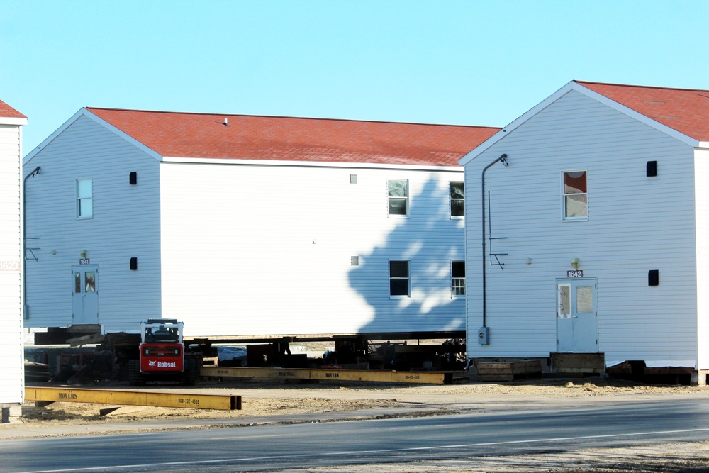 Contractors prepare World War II-era barracks buildings to be moved at Fort McCoy