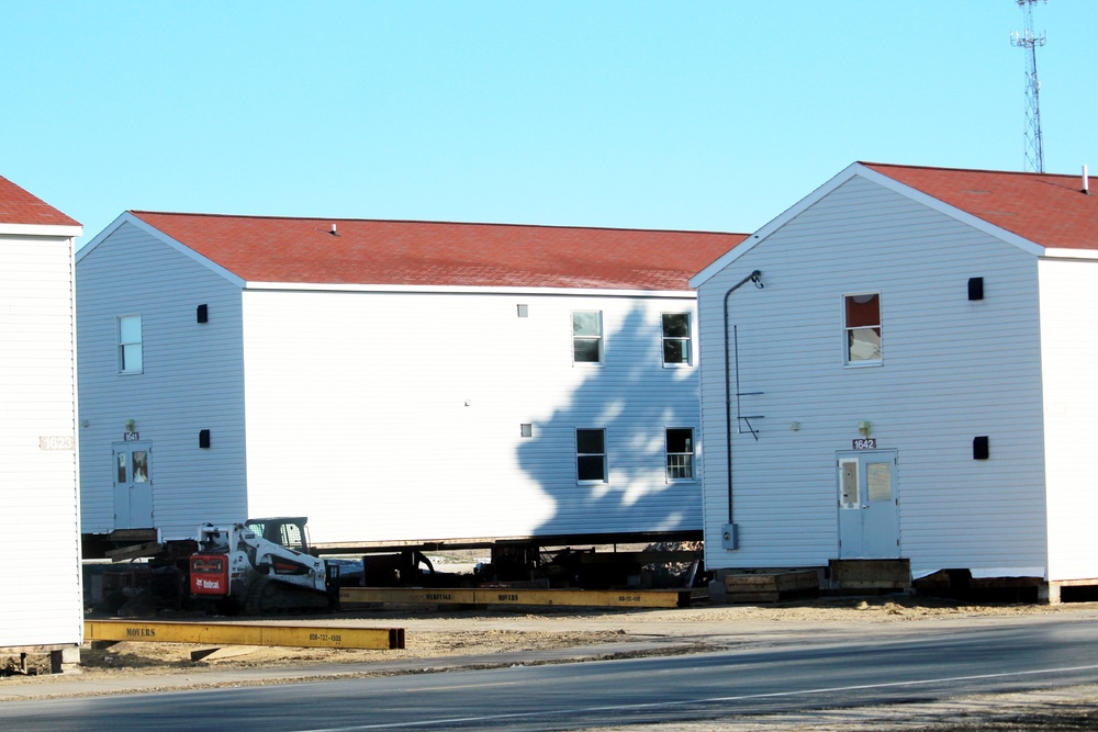 Contractors prepare World War II-era barracks buildings to be moved at Fort McCoy