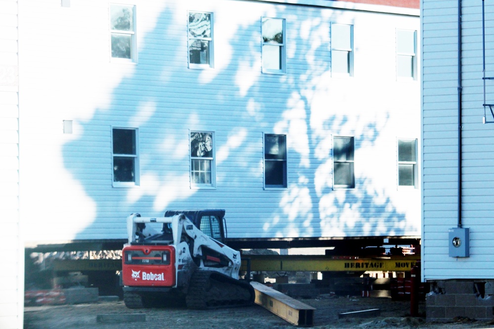 Contractors prepare World War II-era barracks buildings to be moved at Fort McCoy