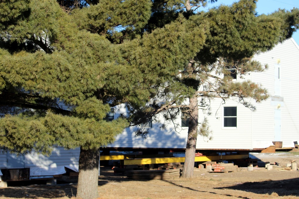 Contractors prepare World War II-era barracks buildings to be moved at Fort McCoy