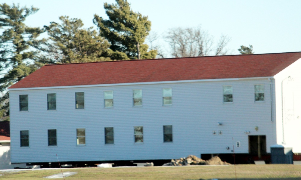 Contractors prepare World War II-era barracks buildings to be moved at Fort McCoy