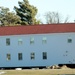 Contractors prepare World War II-era barracks buildings to be moved at Fort McCoy