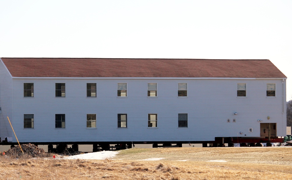 Contractors prepare World War II-era barracks buildings to be moved at Fort McCoy