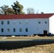 Contractors prepare World War II-era barracks buildings to be moved at Fort McCoy