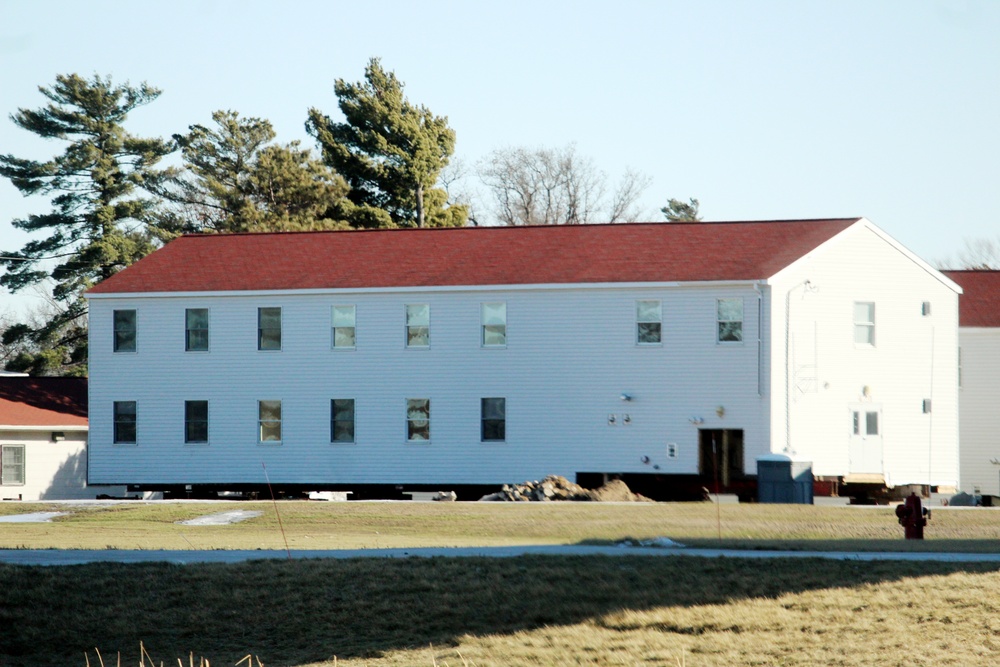 Contractors prepare World War II-era barracks buildings to be moved at Fort McCoy