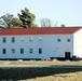 Contractors prepare World War II-era barracks buildings to be moved at Fort McCoy