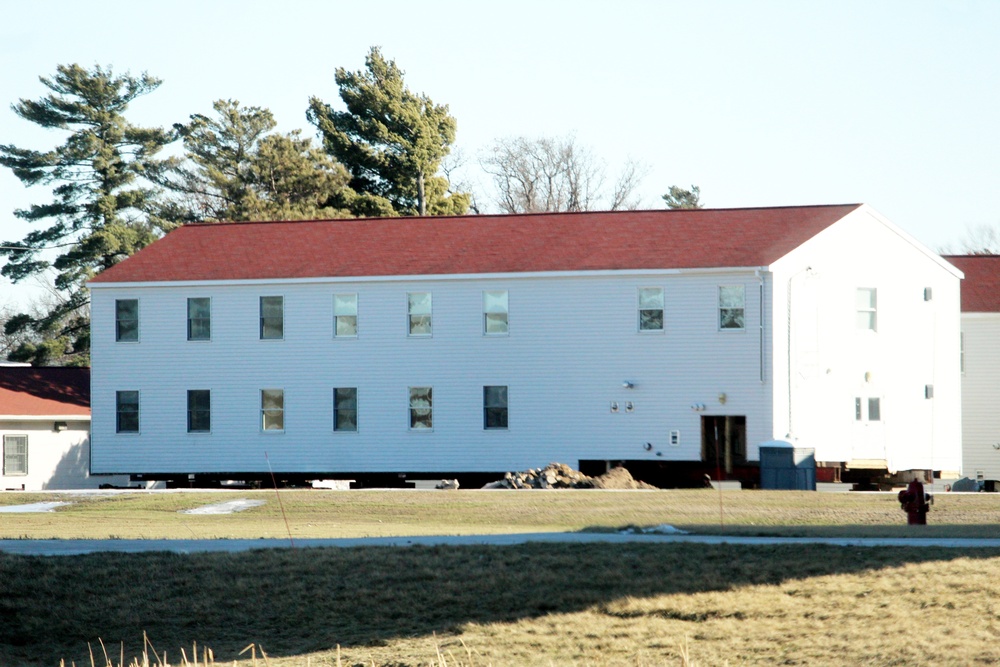 Contractors prepare World War II-era barracks buildings to be moved at Fort McCoy