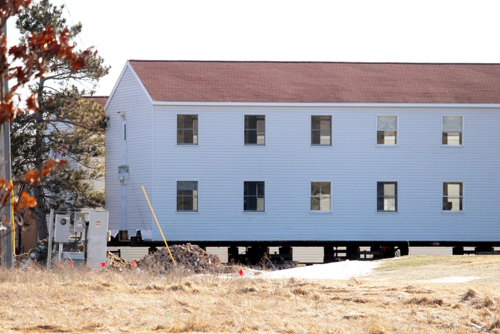 Contractors prepare World War II-era barracks buildings to be moved at Fort McCoy