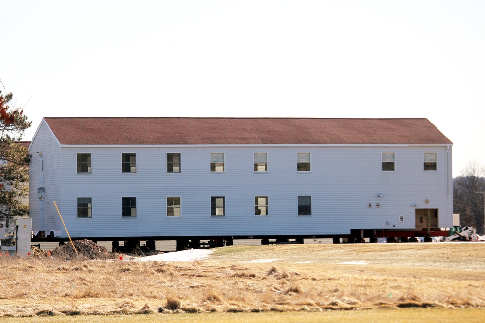 Contractors prepare World War II-era barracks buildings to be moved at Fort McCoy