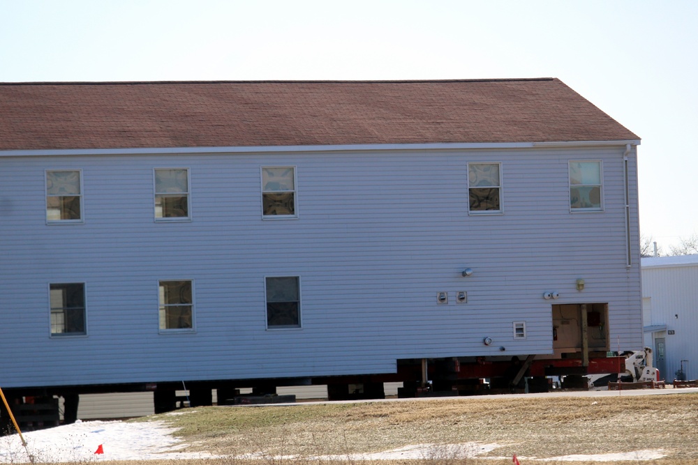 Contractors prepare World War II-era barracks buildings to be moved at Fort McCoy