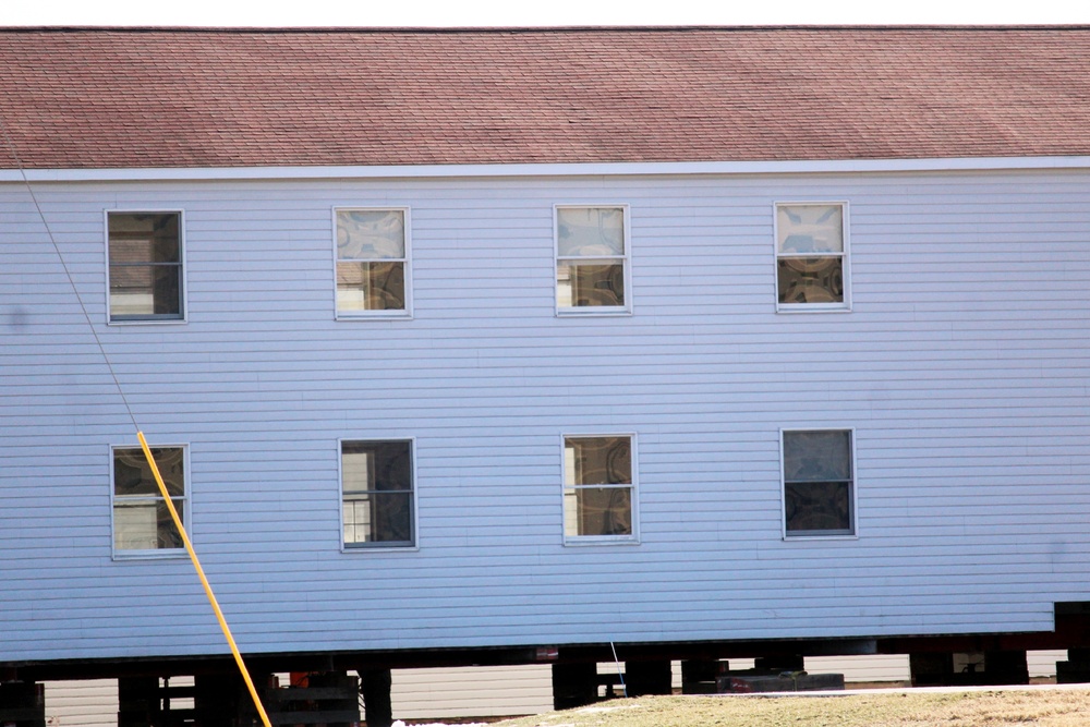 Contractors prepare World War II-era barracks buildings to be moved at Fort McCoy