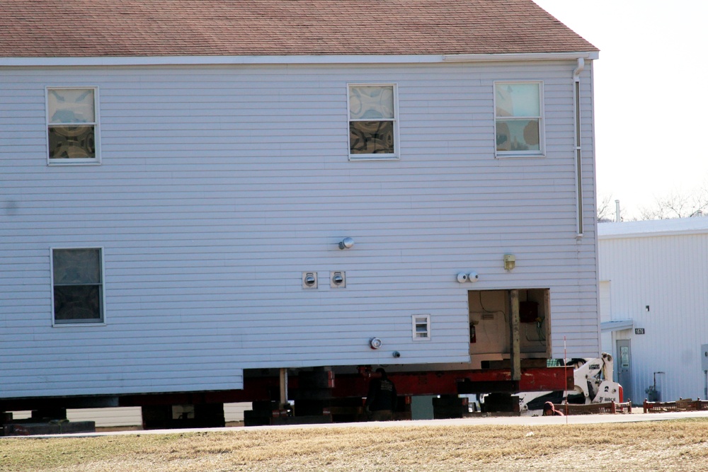 Contractors prepare World War II-era barracks buildings to be moved at Fort McCoy