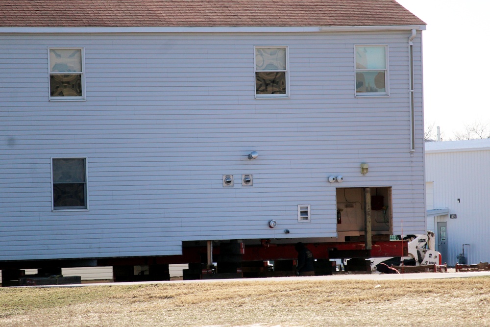 Contractors prepare World War II-era barracks buildings to be moved at Fort McCoy