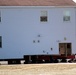 Contractors prepare World War II-era barracks buildings to be moved at Fort McCoy