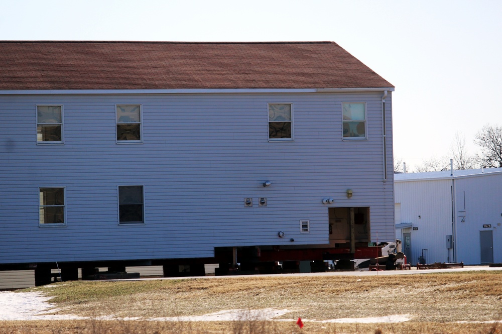 Contractors prepare World War II-era barracks buildings to be moved at Fort McCoy