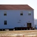 Contractors prepare World War II-era barracks buildings to be moved at Fort McCoy