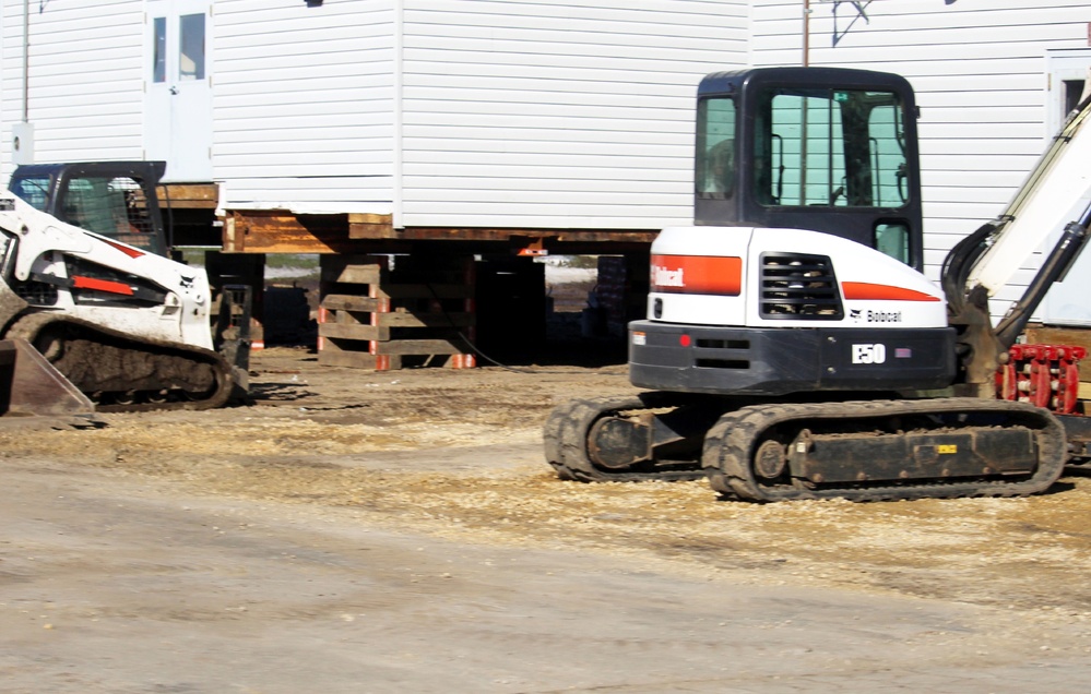 Contractors prepare World War II-era barracks buildings to be moved at Fort McCoy