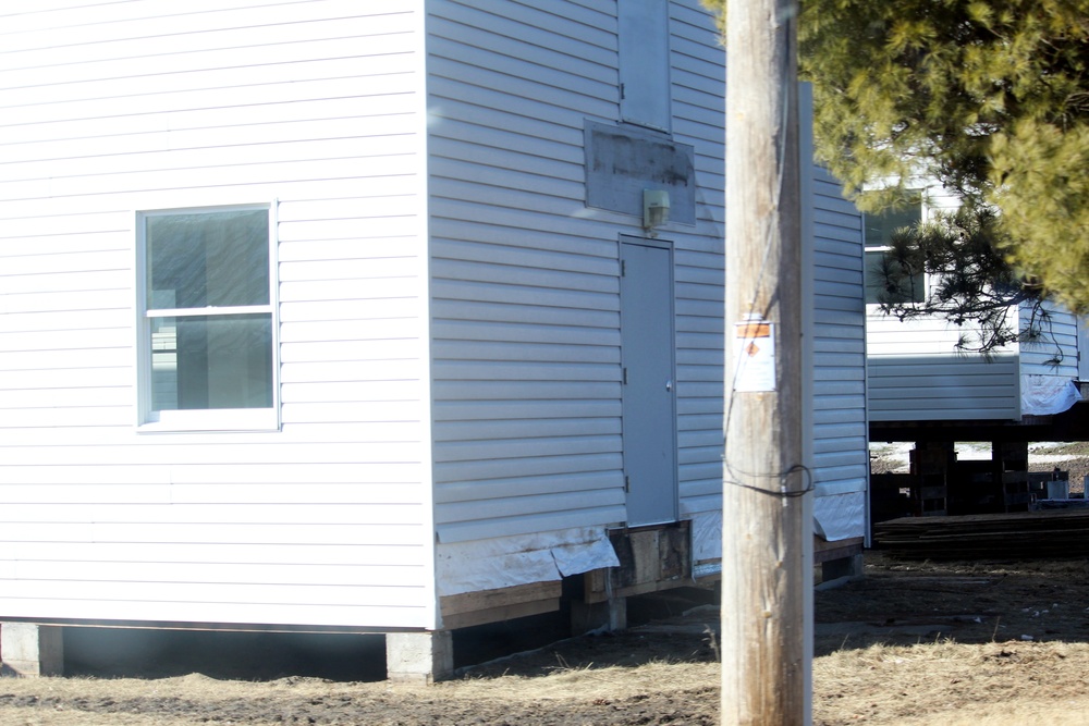 Contractors prepare World War II-era barracks buildings to be moved at Fort McCoy