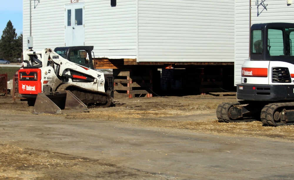 Contractors prepare World War II-era barracks buildings to be moved at Fort McCoy