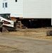 Contractors prepare World War II-era barracks buildings to be moved at Fort McCoy