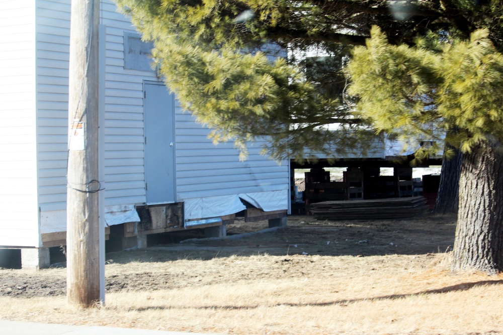 Contractors prepare World War II-era barracks buildings to be moved at Fort McCoy